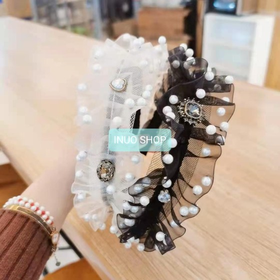 Pinza con forma de mariposa con perlas